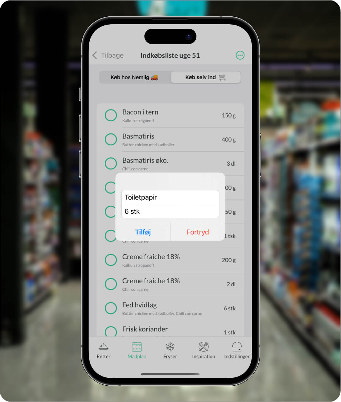 Visning af pop-up i Nem Madplan appen, hvor man kan tilføje egne varer som toiletpapir til indkøbslisten, hvilket gør indkøbslisten endnu mere fleksibel og komplet.